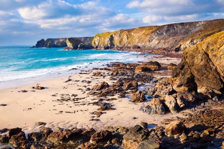 Dramatic winters light on the remote Pentreath Beach on the Lizard Peninsula Cornwall England UK