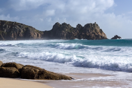 The beautiful golden sandy beach at Porthcurno Cornwall England UKの写真素材