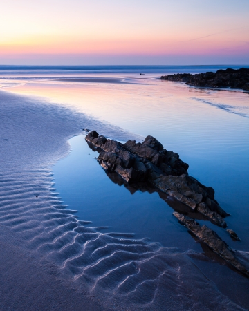 Sunset on the beautiful beach at Croyde on the North Devon Coast England UKの写真素材
