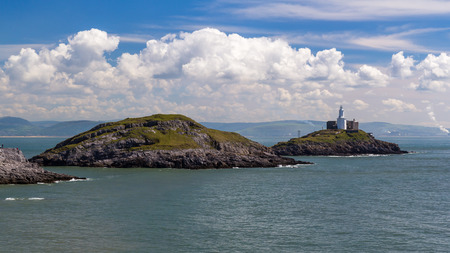 Mumbles Point and Lighthouse from Bracelet Bay Wales UK Europeの写真素材