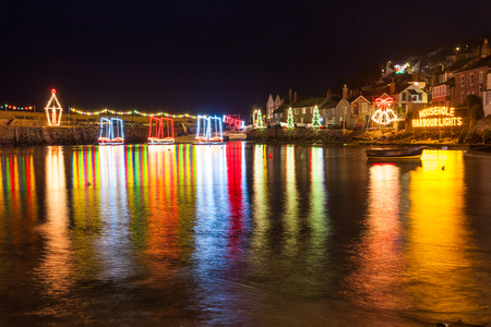 Beautiful display of Christmas Lights at Mousehole Harbour Cornwall England UK Europeの写真素材
