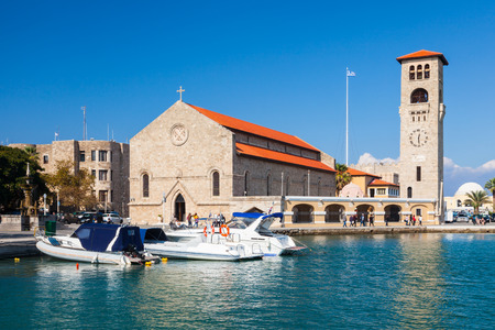 Sunny day at Evangelismos Church at Mandraki Harbour Rhodes Greece Europeのeditorial素材
