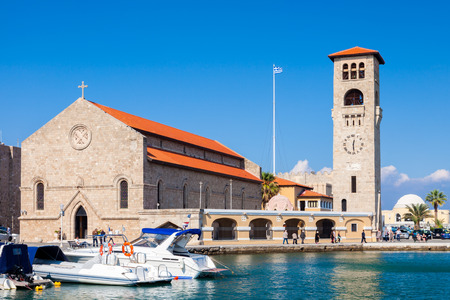 Sunny day at Evangelismos Church at Mandraki Harbour Rhodes Greece Europeのeditorial素材