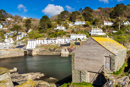 Overlooking the fishermans net loft at the entrance to Polerro Harbour Cornwall England UK Europeの写真素材