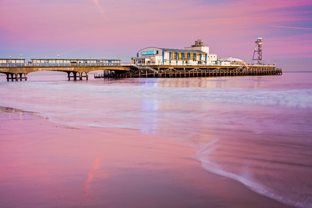 Bournemouth pier at Sunset from beach Dorset England UK Europeの写真素材
