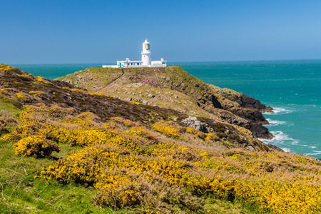Strumble Head and the 1908 Lighthouse on the Pembrokeshire coast of Wales UK Europeの写真素材