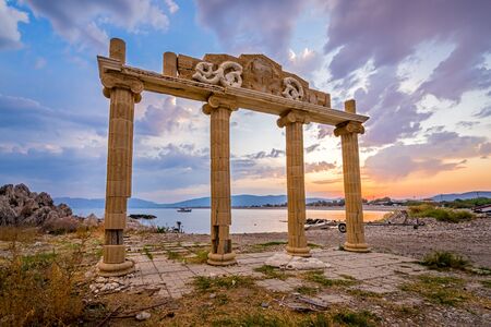 Sunset and Greek column ruins at Haraki Beach Charaki on the Island of Rhodes in the Dodecanese Greece Europeの写真素材