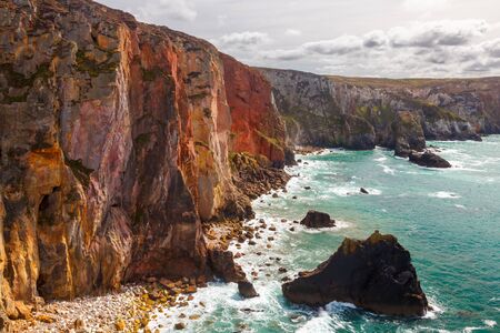 Dramtic coastline and colourful cliffs at Cligga Head the site of former mining activity in Cornwall England UKの写真素材