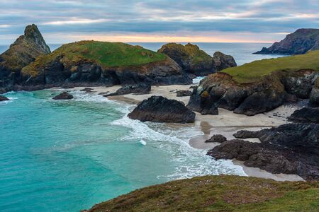 Sunset overlooking the beach at Kynance Cove Cornwall England UK