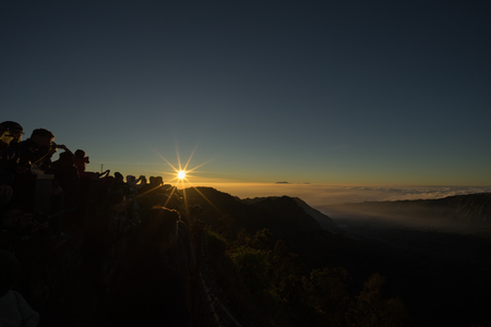 People crown and waiting to see first light of the dayの写真素材