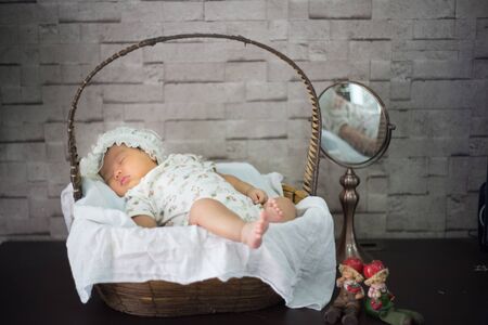 After infant eat breast milk from her mother and the she sleep on the pad bedの写真素材