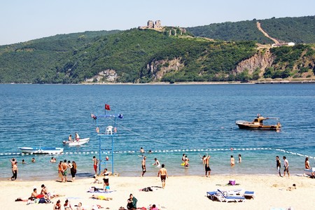Rumeli Kavagi, Istanbul - June10, 2009: People relax on the cool Bosporus beach in the begining of the summerのeditorial素材