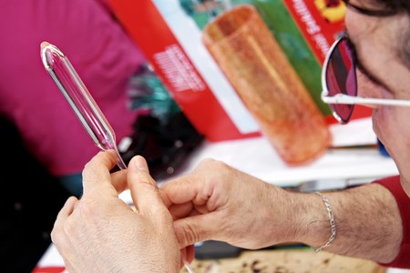 Istanbul - April 25, 2010: Glass blower displays the art of making glassware at Maltepe, Marmara Egitim Koyu. Vendors sell various kind of home made items here.のeditorial素材