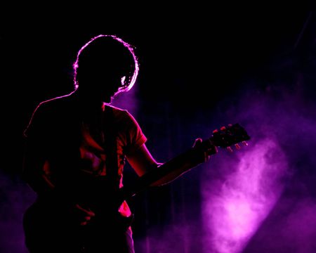 ISTANBUL - MAY 14: Band Mor ve Otesi performs live at Maltepe open air stage. Guitarist Kerem Ozyegen of the rock group playsのeditorial素材