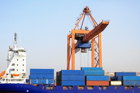Freight containers on board under crane bridge