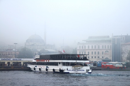 ISTANBUL - NOVEMBER 22: Heavy fog over Bosphorus shut down cross-city sea traffic early Monday morning. Eminonu port seen from aboveのeditorial素材