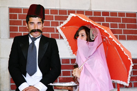 ISTANBUL - SEPTEMBER 02, 2009: Orient Express arrives at last stop at 14:30 pm. Young couple in Ottoman costume greets the travellersのeditorial素材
