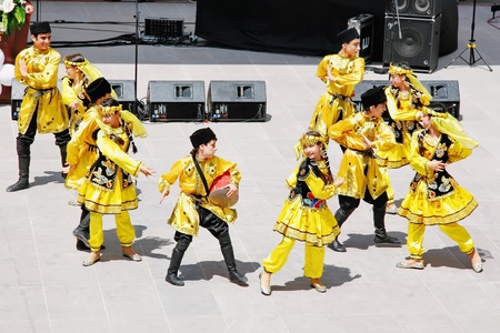 ISTANBUL - APRIL 23: Azerbaijan group perform folk dance in "National Sovereignty and Children Day" festival on April 23, 2010 in Istanbul, Turkeyのeditorial素材