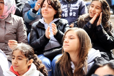 ISTANBUL - APRIL 23: Unidentified fans cheer up during pop singer Bengu Erden performs live at Marmara Egitim Kurumlari on April 23, 2011 in Istanbul, Turkey. のeditorial素材