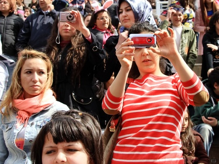 ISTANBUL - APRIL 23: Unidentified music fans records the show during Bengu Erden Concert at Marmara Egitim Kurumlari on April 23, 2011 in Istanbul, Turkey.のeditorial素材