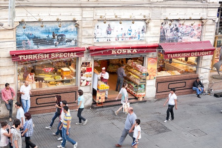 ISTANBUL - JULY 06: People on front of traditional Koska Helvacisi at Istiklal Street on July 06, 2010 in Istanbul. Sweet restaurant Koska specials are Halva, Turkish Delight and Marzipan.のeditorial素材