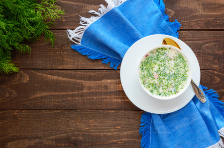 Slavic traditional dish - cold soup "Okroshka" on yogurt. Dietary refreshing dish. The top viewの写真素材