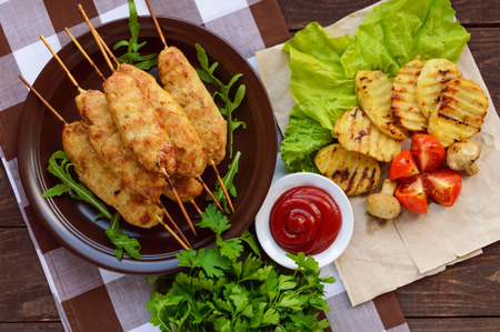 Grilled meat on a skewer - lula kebab. The traditional dish of the Caucasus, Central Asia and Turkey. Grilled vegetables.The top viewの写真素材