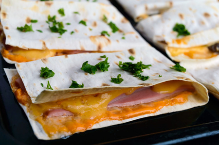 Layer Cake (pizza) from a thin pita, stuffed with sausage, cheese sauce.