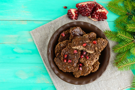 Juicy liver cutlets with pomegranate seeds on a clay bowl. The top view.の写真素材