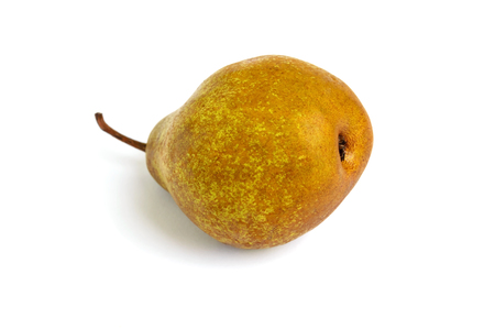 A large yellow (brown) pear lies on its side isolated on a white background.の写真素材