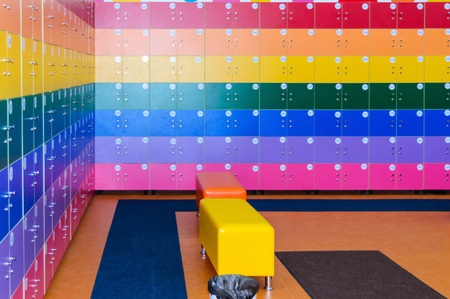 The wall is decorated with multi-colored storage chambers. A variant of the interior for children's rooms, shops, gambling halls. Numbered cell storage in a baggage roomの写真素材