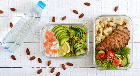 Different types of lunch boxes on a white wooden background. Top view, flat lay. Delicious healthy...