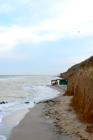 Beautiful view on the sea and the waves crashing on the shore. Cliff on the coast.の写真素材