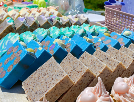 Beautiful colorful handmade soap. Soap manufacture Eco goods. Fair - an exhibition of folk craftsmen.の写真素材