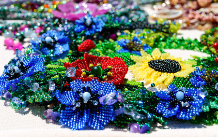 Selling beautiful colorful women's jewelry from beads. Fair - an exhibition of folk craftsmen.の写真素材