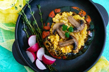 Lentil porridge with mushrooms in a pumpkin pot. Dietary, lean menu. Vegetarian dish. Top view.の写真素材