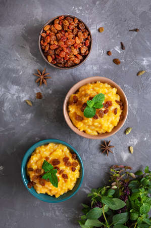 Pumpkin porridge with rice and raisins. Tasty healthy diet breakfast. Proper nutritionの写真素材