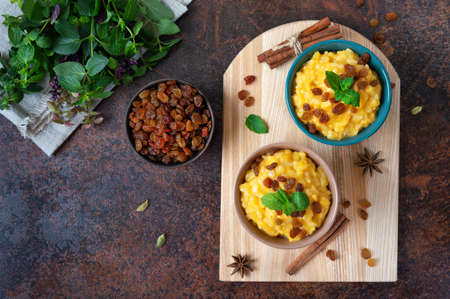 Pumpkin porridge with rice and raisins. Tasty healthy diet breakfast. Proper nutritionの写真素材