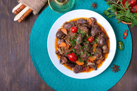 Roast turkey liver with vegetables and herbs. Diet dish. Top viewの写真素材