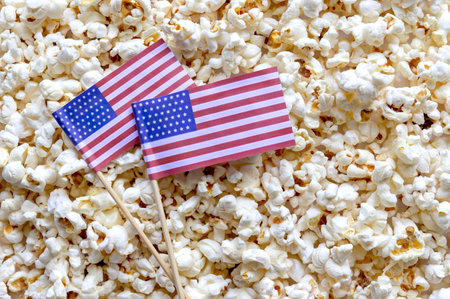 Pile of popcorn and USA flags with a place for an inscription. America independence day holiday...