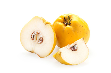 Quince with slices on a white backgroundの写真素材