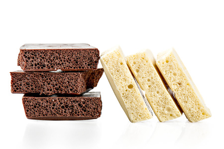 Black and white chocolate on a white backgroundの写真素材