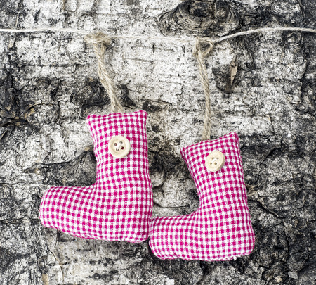 Christmas shoes on a wooden backgroundの写真素材