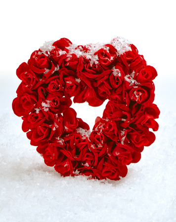 Red stone heart in artificial snowの写真素材