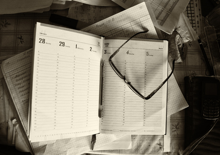 office working environment glasses pen notebook workの写真素材