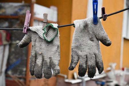 Old dirty glove on the forest ground.の写真素材