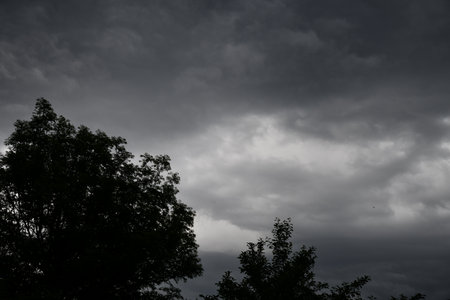 Dark clouds over a fieldの写真素材