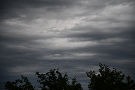 Dark clouds over an agricultural fieldの写真素材