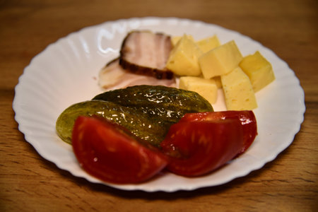 Overhead shot of a colorful veggie flatbread with cherry tomatoes, arugula, and goat cheeseの写真素材