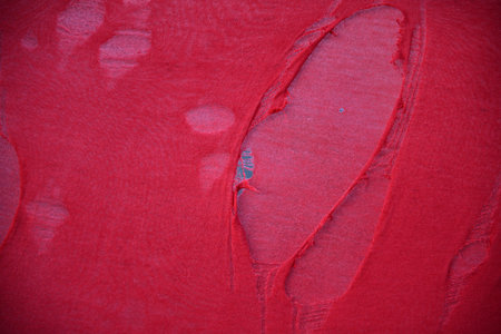 hanging teared rag spread isolated on black background , can use like a background or any texture....